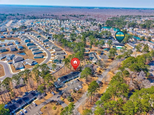 bird's eye view featuring a water view and a residential view