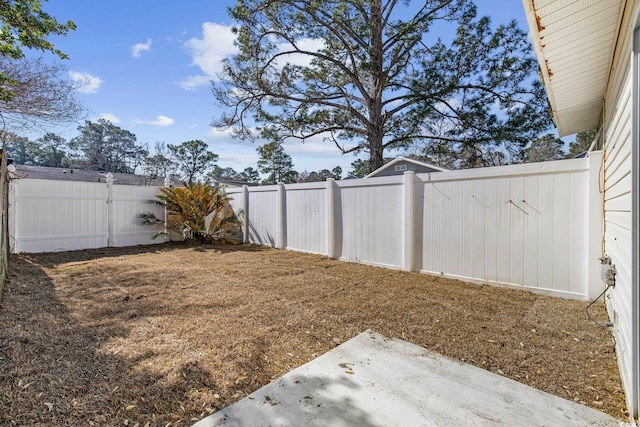 view of yard with a fenced backyard