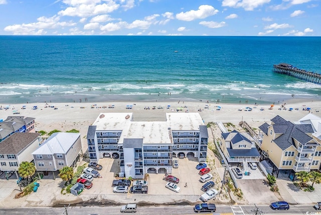 aerial view featuring a water view and a beach view