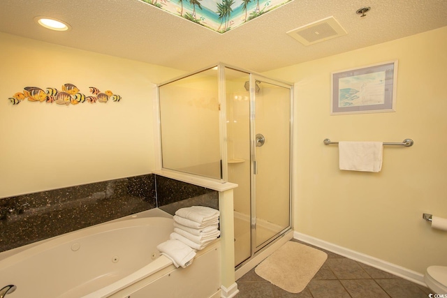 bathroom featuring a stall shower, visible vents, baseboards, a jetted tub, and tile patterned flooring