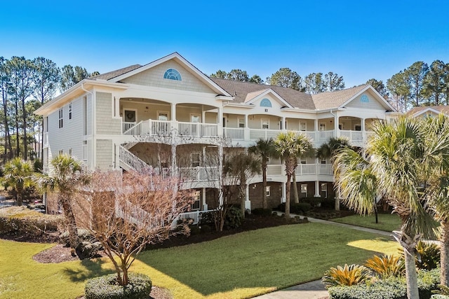 exterior space featuring stairs and a front yard