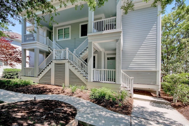 exterior space featuring stairs and a porch