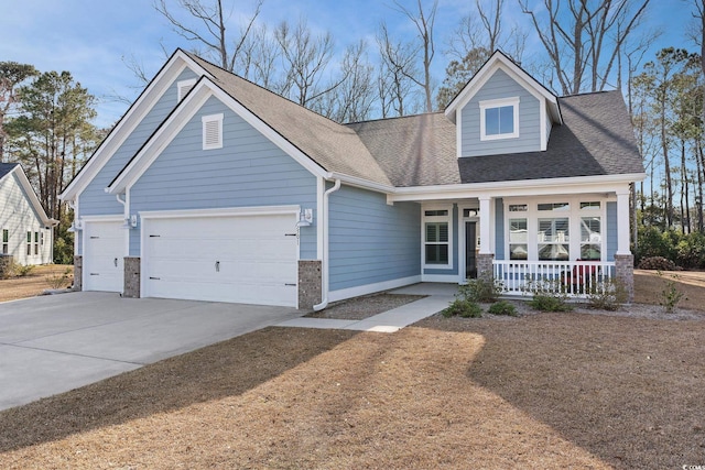 view of front of home with a garage, concrete driveway, a porch, and roof with shingles