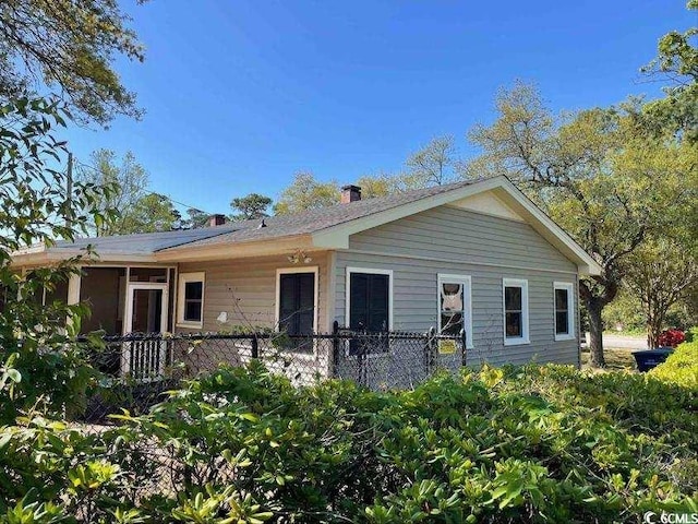 ranch-style home with fence