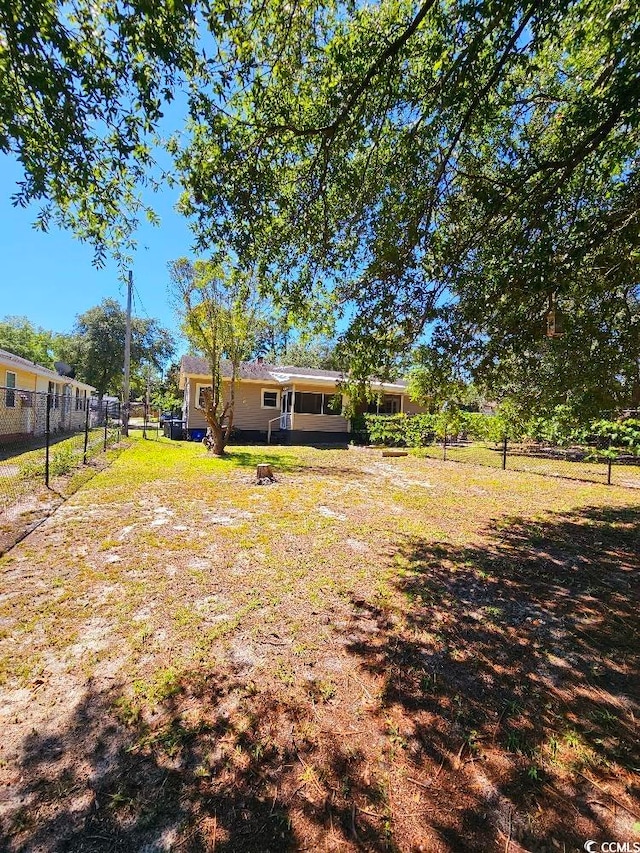 view of yard with a fenced backyard