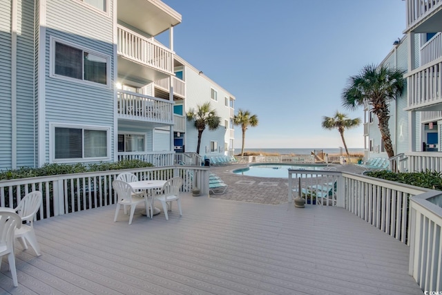 deck featuring a community pool