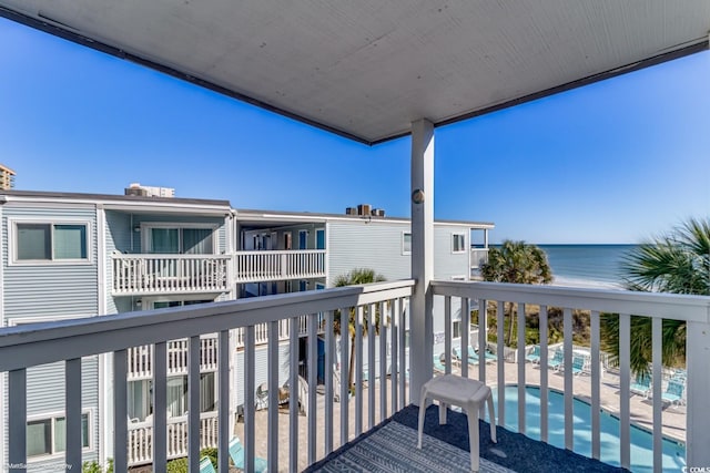 balcony featuring a water view