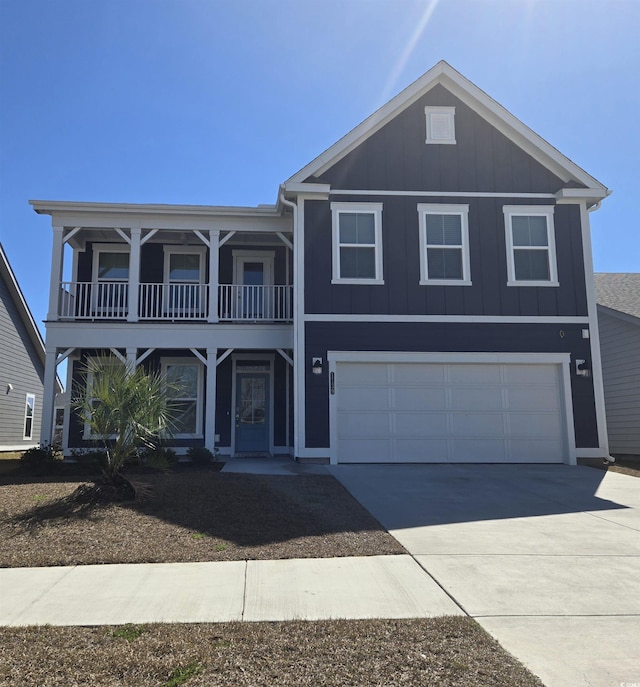 view of front facade featuring driveway, a garage, and board and batten siding