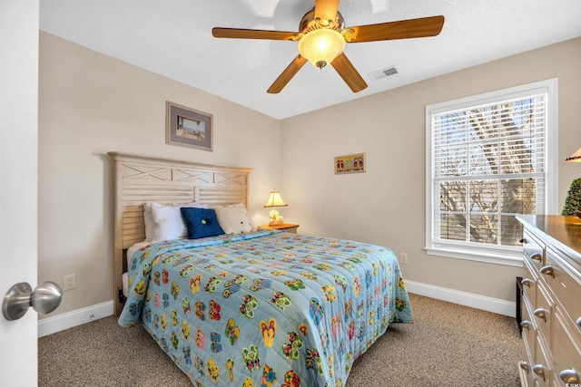 bedroom with carpet, visible vents, ceiling fan, and baseboards