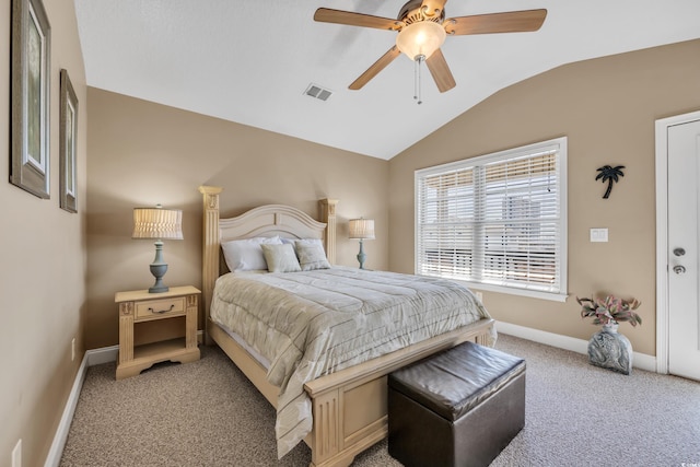 bedroom with light colored carpet, visible vents, vaulted ceiling, and baseboards