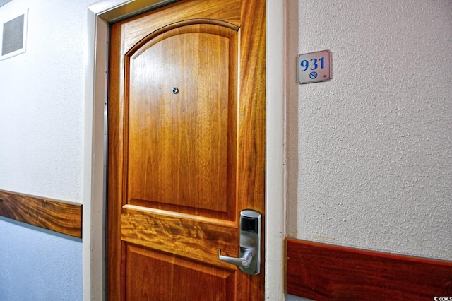 room details with visible vents and a textured wall