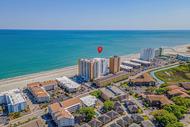 aerial view featuring a water view and a view of the beach