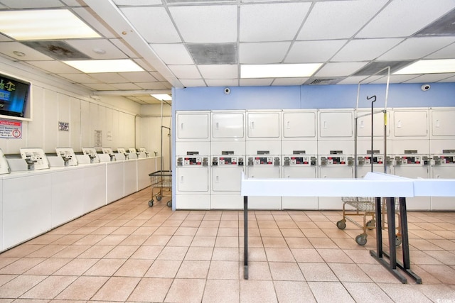 interior space with stacked washer and dryer and washing machine and clothes dryer