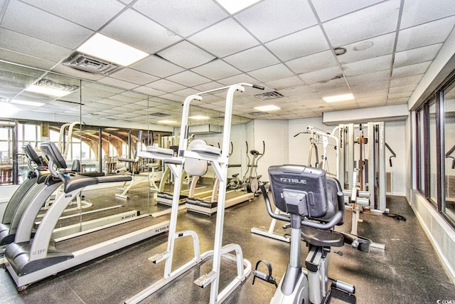 exercise room featuring visible vents and a drop ceiling