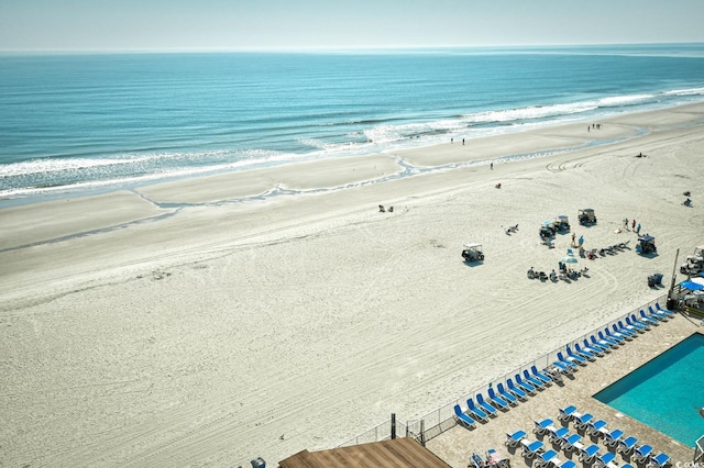 drone / aerial view with a water view and a view of the beach