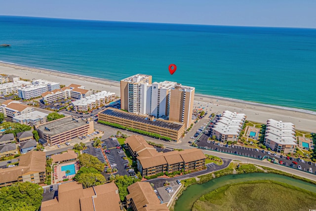 bird's eye view with a beach view and a water view