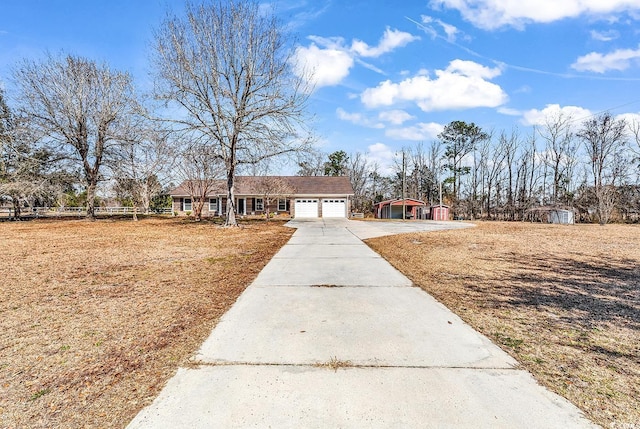 view of front of house featuring driveway and an attached garage