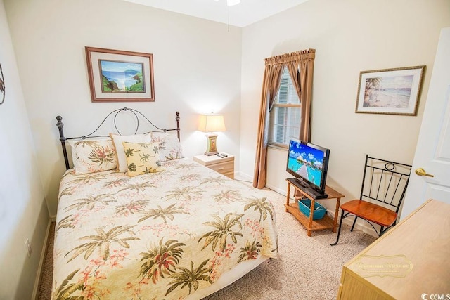 carpeted bedroom with baseboards