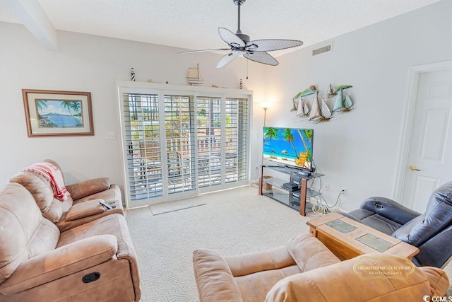 living area with carpet, visible vents, ceiling fan, and a textured ceiling