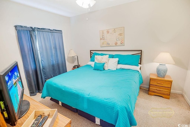 bedroom with carpet floors and baseboards