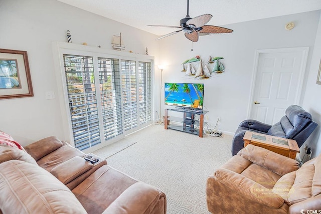 living area with carpet flooring, a ceiling fan, and baseboards