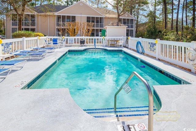 pool featuring a sunroom