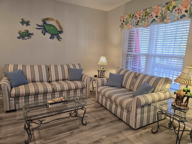 bedroom featuring ceiling fan, a textured ceiling, visible vents, and wood finished floors