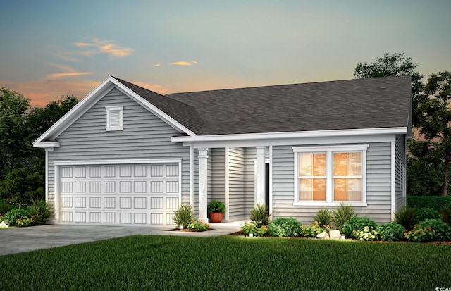 view of front of property with a shingled roof, a front yard, concrete driveway, and an attached garage