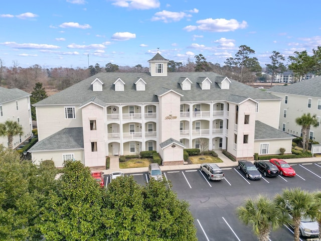 view of property with uncovered parking