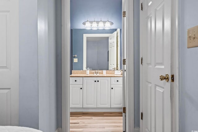 bathroom featuring vanity and wood finished floors
