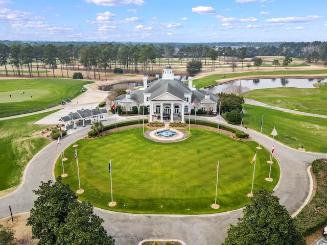 aerial view featuring golf course view and a water view