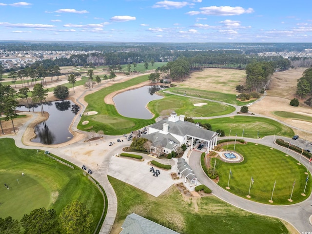 birds eye view of property featuring a water view and golf course view