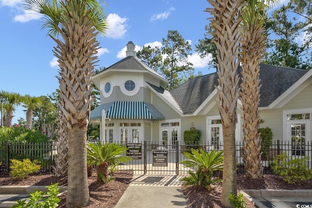 exterior space featuring a fenced front yard and a gate