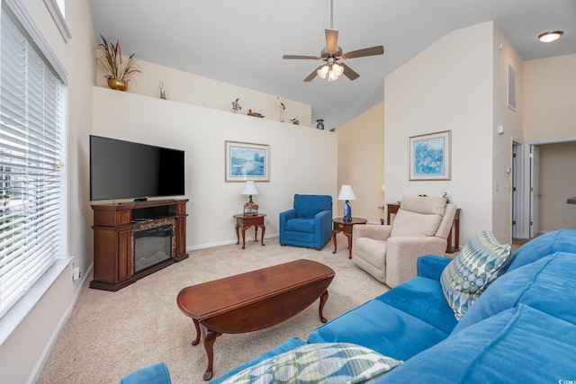 286 Bonnie Bridge Cir, Myrtle Beach, SC 29579 - living room featuring carpet floors, high vaulted ceiling, a ceiling fan, a glass covered fireplace, and baseboards