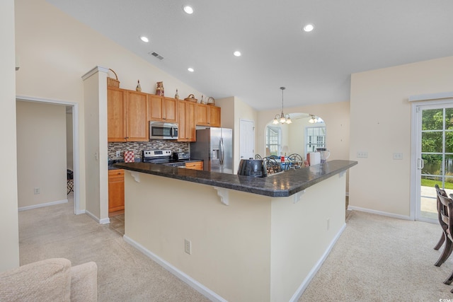 286 Bonnie Bridge Cir, Myrtle Beach, SC 29579 - kitchen featuring appliances with stainless steel finishes, light carpet, a chandelier, a breakfast bar area, and recessed lighting
