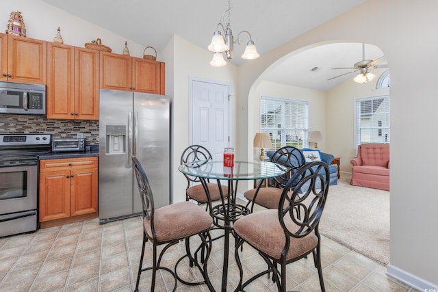 286 Bonnie Bridge Cir, Myrtle Beach, SC 29579 - kitchen with stainless steel appliances, lofted ceiling, arched walkways, a ceiling fan, and backsplash