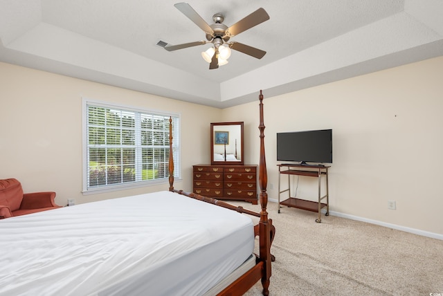 286 Bonnie Bridge Cir, Myrtle Beach, SC 29579 - carpeted bedroom with baseboards, a tray ceiling, and a ceiling fan