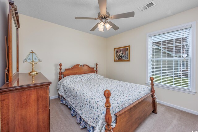 286 Bonnie Bridge Cir, Myrtle Beach, SC 29579 - bedroom featuring light colored carpet, baseboards, multiple windows, and a ceiling fan