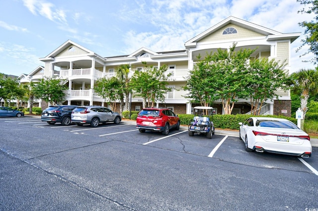 view of property with uncovered parking