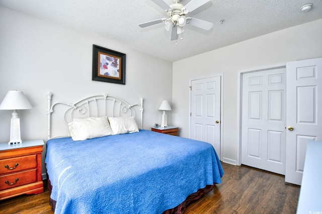 bedroom with a ceiling fan, a textured ceiling, and wood finished floors