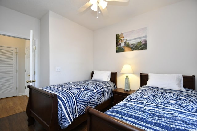 bedroom featuring wood finished floors and a ceiling fan