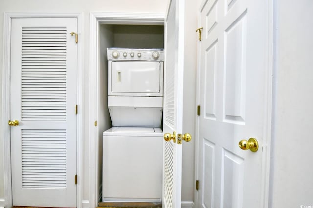 laundry area featuring laundry area and stacked washer / dryer