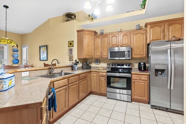 kitchen featuring stainless steel appliances, a peninsula, a sink, visible vents, and light countertops