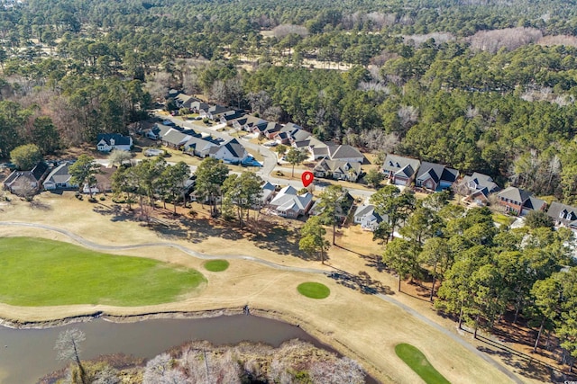 aerial view with golf course view, a water view, and a residential view