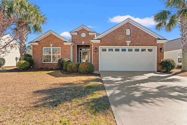 4517 Planters Row Way, Myrtle Beach, SC 29579 - traditional home featuring a garage, brick siding, a front lawn, and driveway