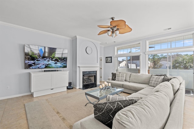 4517 Planters Row Way, Myrtle Beach, SC 29579 - tiled living area with ornamental molding, ceiling fan, a premium fireplace, baseboards, and visible vents