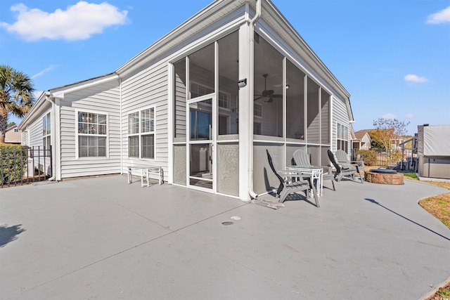 4517 Planters Row Way, Myrtle Beach, SC 29579 - back of property with a patio, a fire pit, fence, and a sunroom