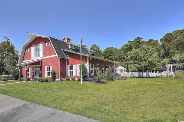 4517 Planters Row Way, Myrtle Beach, SC 29579 - exterior space with a lawn, a gambrel roof, fence, and roof with shingles