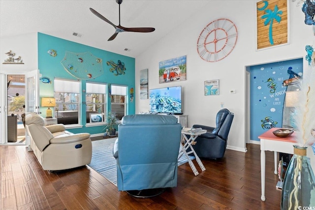 living area featuring ceiling fan, high vaulted ceiling, visible vents, baseboards, and hardwood / wood-style floors