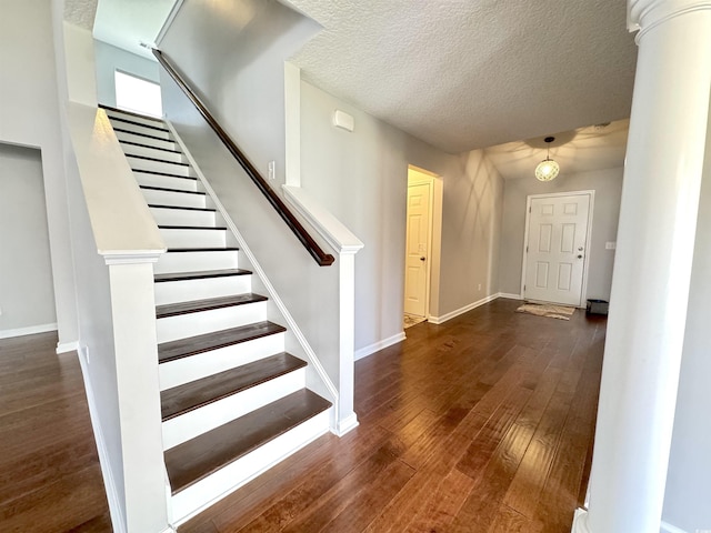 556 Cedar Lakes Dr, Little River, SC 29566 - foyer entrance with hardwood / wood-style floors, stairs, a textured ceiling, and ornate columns